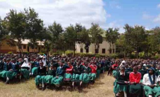 Students from Banjika Secondary School listening to the sensitization team